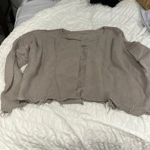 Planet taupe fringed bottom sweater with center cut out
